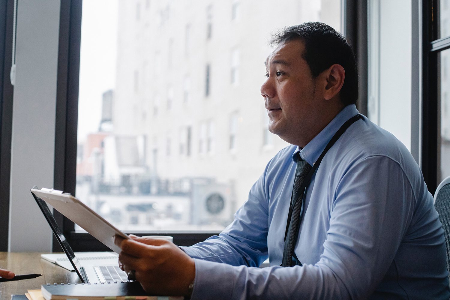 Image of a manager reading a report